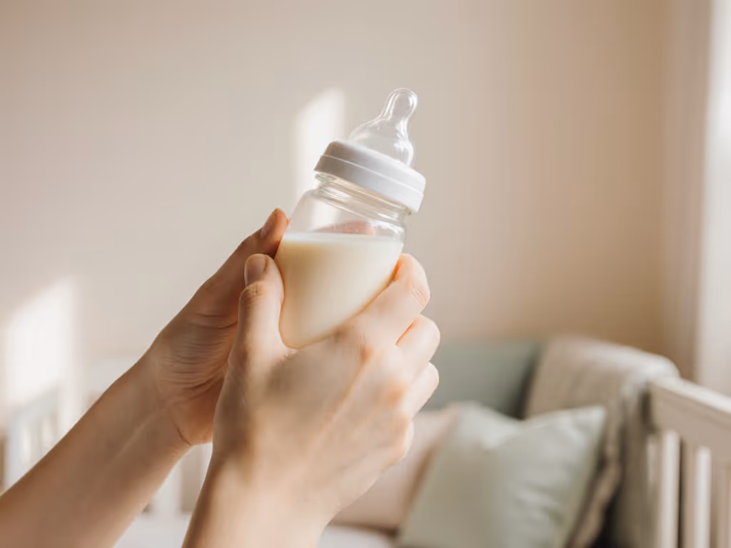 caregiver using paced bottle feeding technique